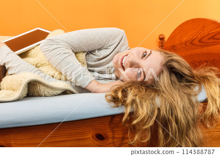 Young woman girl with tablet browsing internet. Young woman girl with tablet browsing internet. 114388787
