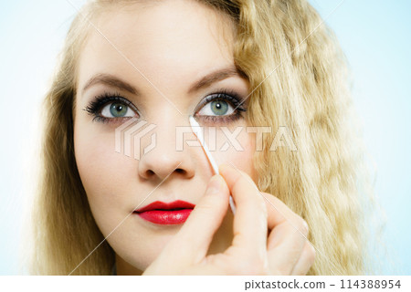 Professional artist fixing fashion model make up 114388954