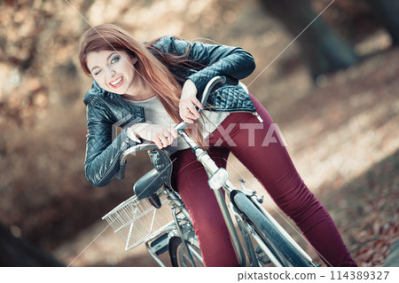 Fashionable girl with bike. Fashionable girl with bike. 114389327