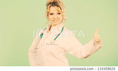Female doctor showing thumb up. 114389628