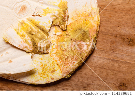 Rotten bread on table. 114389691