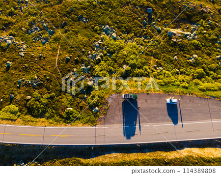 Top down view. Camper car on road, Hardangervidda plateau, Norway Top down view. Camper car on road, Hardangervidda plateau, Norway 114389808