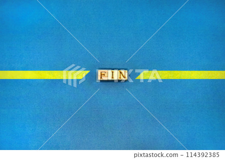 Yellow tape line with cut FIN block in center on blue background 114392385