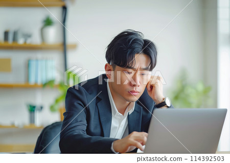 AI image of a man thinking while working remotely AI image of a man thinking while working remotely 114392503