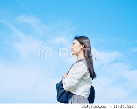School girls looking up at the sky 114393521