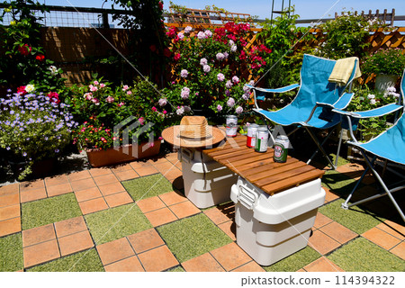 Relax and unwind on the best balcony surrounded by flowers for a soothing moment Relax and unwind on the best balcony surrounded by flowers for a soothing moment 114394322