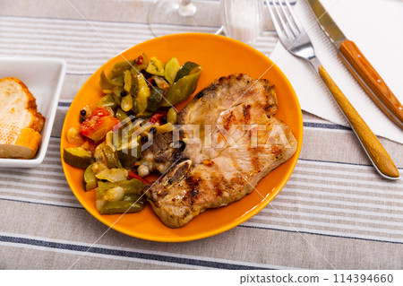 Pork steak with stewed vegetables 114394660