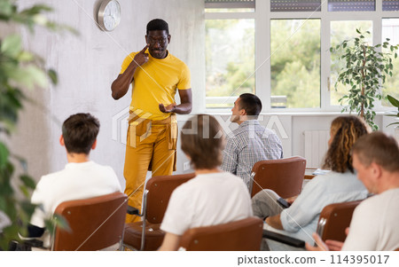 African american man leads a lecture during a meeting of men gays 114395017