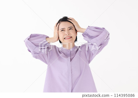 Middle-aged woman portrait headache 114395086