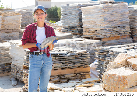 Young female worker in facing stone warehouse 114395230