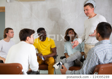 Group of men gays are discussing something during a meeting Group of men gays are discussing something during a meeting 114395289