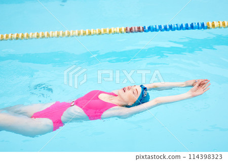 gorgeous woman in pink swimwear relaxing in the resort 114398323