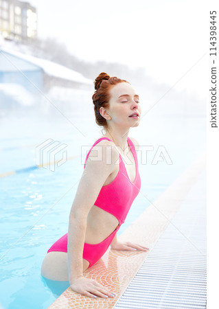 Portrait beautiful young woman relaxing in the pool 114398445