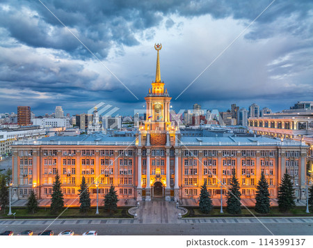 Yekaterinburg City Administration or City Hall and Central square at summer evening. Evening city in the summer sunset, Aerial View. Yekaterinburg City Administration or City Hall and Central square at summer evening. Evening city in the summer sunset, Aerial View. 114399137