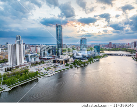 Yekaterinburg city with Buildings of Regional Government and Parliament, Dramatic Theatre, Iset Tower, Yeltsin Center, panoramic view at summer sunset. 114399146