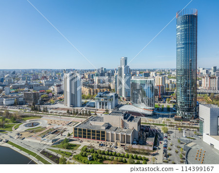 Yekaterinburg city with Buildings of Regional Government and Parliament, Dramatic Theatre, Iset Tower, Yeltsin Center, panoramic view at summer sunset. 114399167