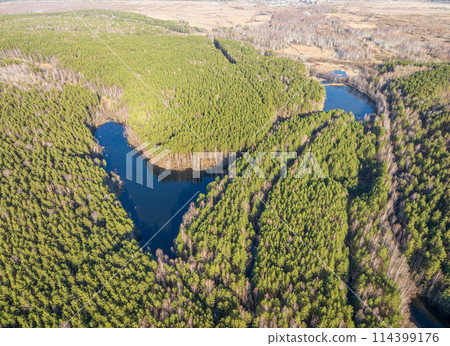 Spring or autumn lake in forest. Aerial view of lake in spring or autumn Spring or autumn lake in forest. Aerial view of lake in spring or autumn 114399176