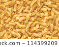 Stack of Uncooked Fusilli, Abstract Backdrop. 114399209