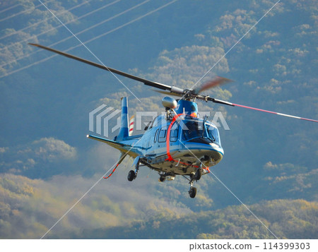 flying police helicopter 114399303