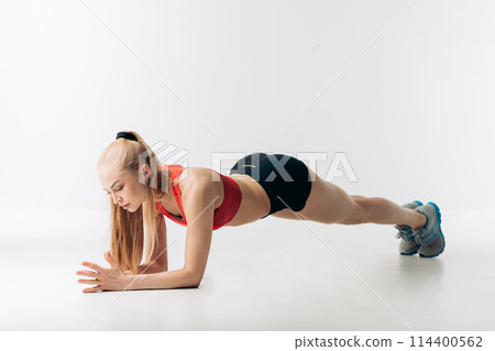 pleasant fit female strengthens her arms pleasant fit female strengthens her arms 114400562