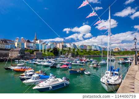 A harbour with colourful buildings in the background (Tenby, Wales, UK) 114400759