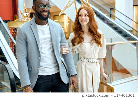 smiling happy diverse couple stsrolling at shop smiling happy diverse couple stsrolling at shop 114401301