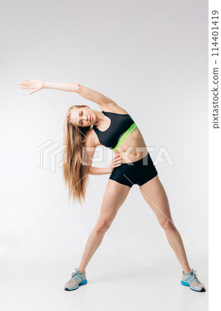 pretty slim fit girl bending to the left pretty slim fit girl bending to the left 114401419