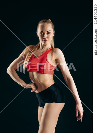 sexy beautiful blond girl is stylish clothes posing to the camera 114401539