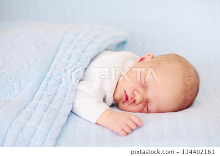Newborn baby boy on a blue blanket Newborn baby boy on a blue blanket 114402161