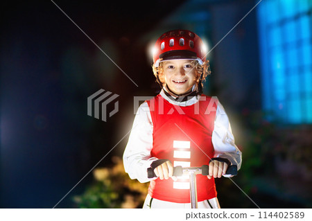 Safety on dark street. Kids reflective vest. 114402589