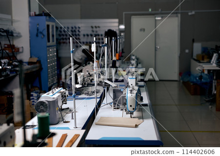 clothing manufacturing factory. sewing department, tailor's sewing room, no people clothing manufacturing factory. sewing department, tailor's sewing room, no people 114402606