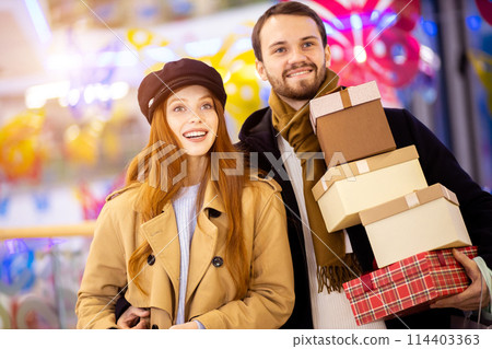 Portrait of happy couple at shopping center 114403363