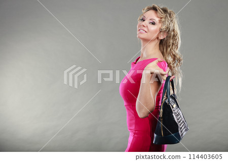 Elegant woman buyer with black bag. 114403605