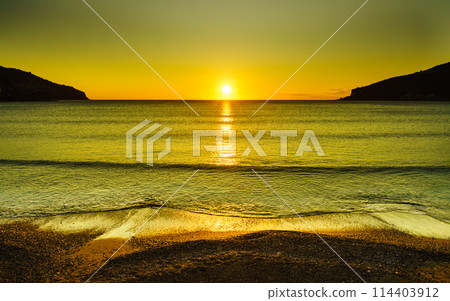 Sunset or sunrise over sea surface 114403912
