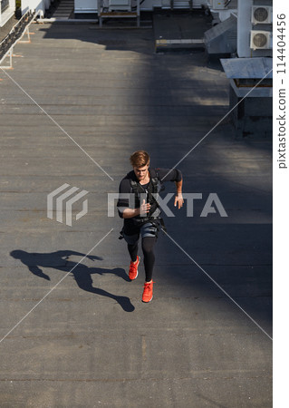young sporty man is trying to run fast young sporty man is trying to run fast 114404456