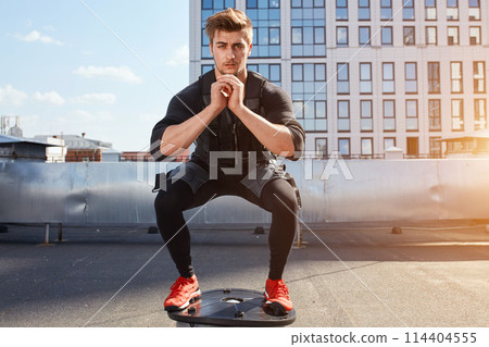 awesome guy working out on fit ball 114404555