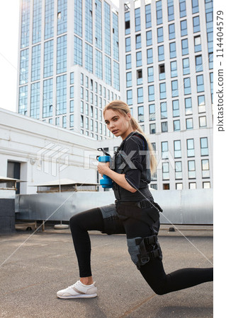 awesome athlete is squatting with electrical muscle 114404579