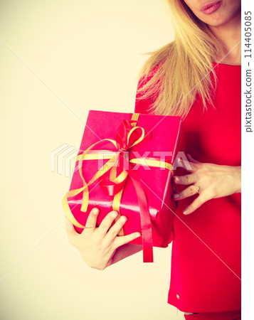 Beautiful woman with big red gift. Beautiful woman with big red gift. 114405085