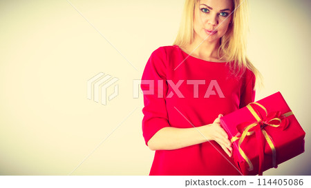 Beautiful woman with red gift. Beautiful woman with red gift. 114405086