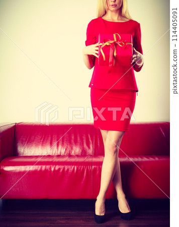 Beautiful woman with big red gift. Beautiful woman with big red gift. 114405091