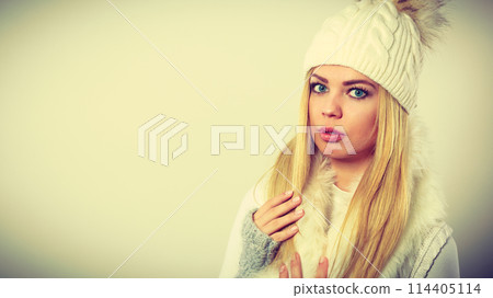 Woman wearing warm winter clothing Woman wearing warm winter clothing 114405114