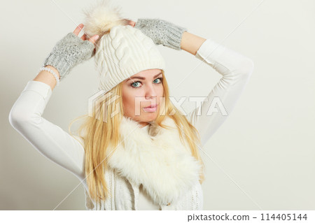 Woman wearing warm winter clothing Woman wearing warm winter clothing 114405144