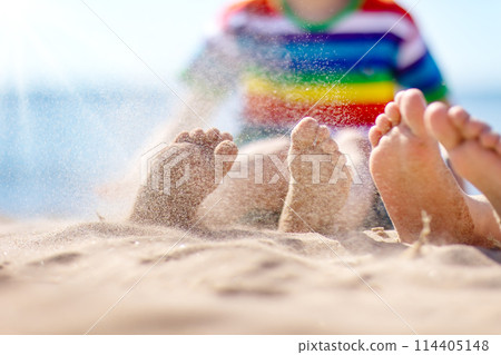 Happy children sitting on the sand beach in sunny day. 114405148