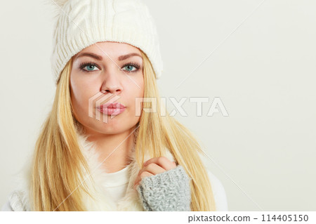 Woman wearing warm winter clothing 114405150