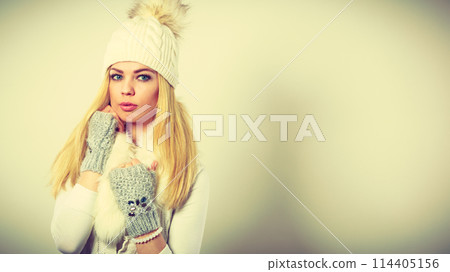 Woman wearing warm winter clothing 114405156