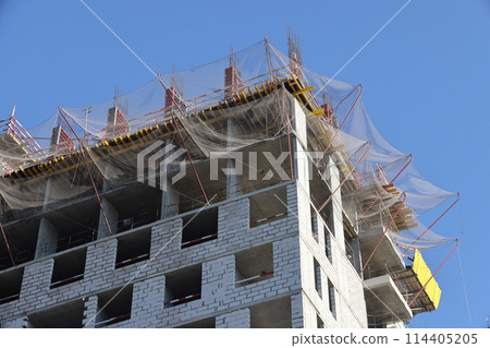 Construction site with cranes against the sky. Construction machinery, construction of skyscrapers. Construction site with cranes against the sky. Construction machinery, construction of skyscrapers. 114405205