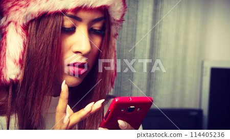 Young woman with cell phone. Young woman with cell phone. 114405236