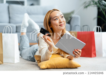 Happy Young Woman Shopping Online With Credit Card At Home 114405846