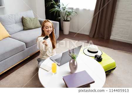 Happy Young Woman Shopping Online With Credit Card At Home Happy Young Woman Shopping Online With Credit Card At Home 114405913