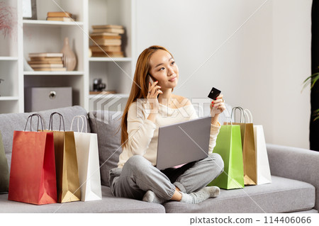 Young Asian Woman Shopping Online With Credit Card And Laptop 114406066